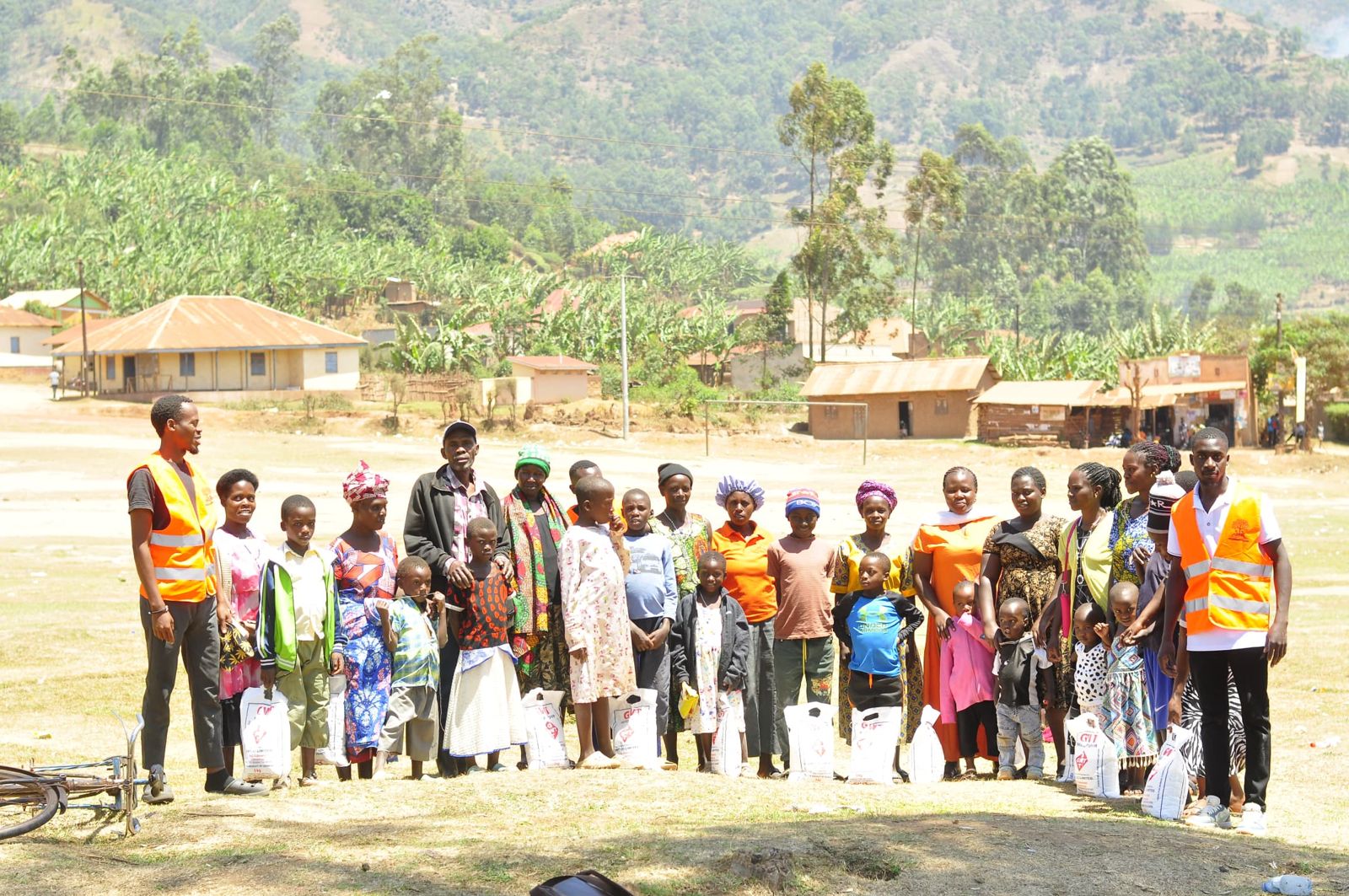 Families and Pathfinders volunteers on solar lantern distribution day in Rukiga